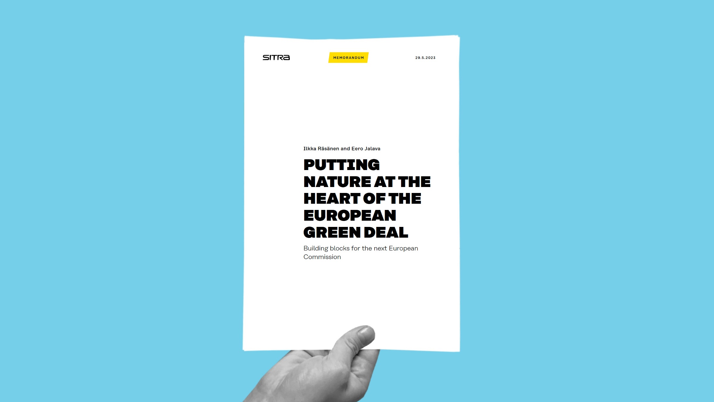 Hand holding Sitra memorandum Putting nature at the heart of European Green Deal